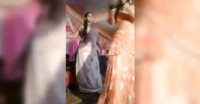 An Indian woman shot at pausing dancing at the wedding