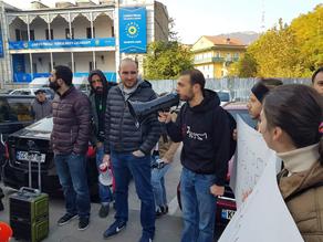 Members of Change Movement gather outside Georgian Dream office