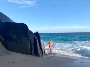 Holidaymaker poses for shot before giant wave wipes her out - VIDEO
