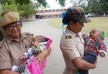 Picture of two police women holding babies wins Twitter