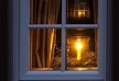 მორწმუნეები შობის ღამეს ფანჯარასთან სანთლებს ანთებენ